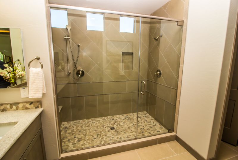 Bathroom Featuring Frameless Glass and Neutral Tones